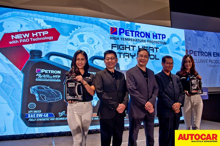 Mr Gary Cheah, Mr Choong Kum Choy and En Mohd Pauzi Mohd Din launch gambit during the Petron Malaysia HTP Engine Oil launch